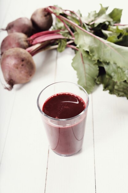 Beetroot juice on white wooden table