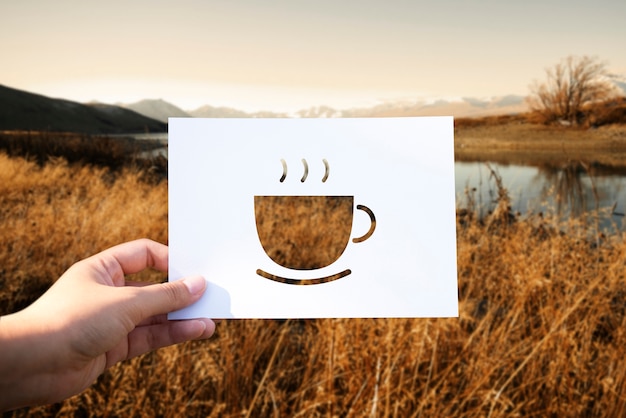 Free photo beginning new day with cup of coffee perforated paper