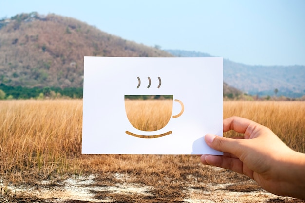 Free photo beginning new day with cup of coffee perforated paper