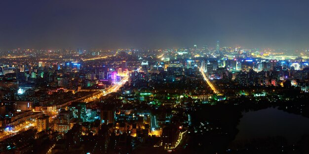 Beijing at night aerial view with urban buildings.