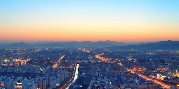 Beijing sunset aerial view with urban buildings.