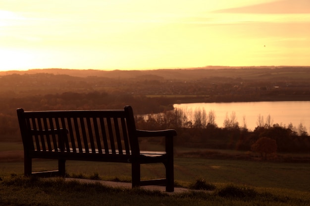 Free Photo bench at sunset