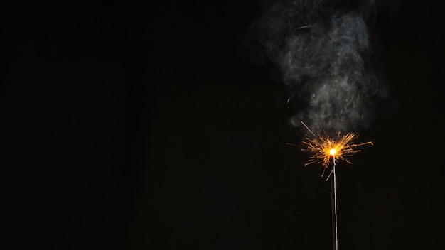 Bengal light with sparks and smoke