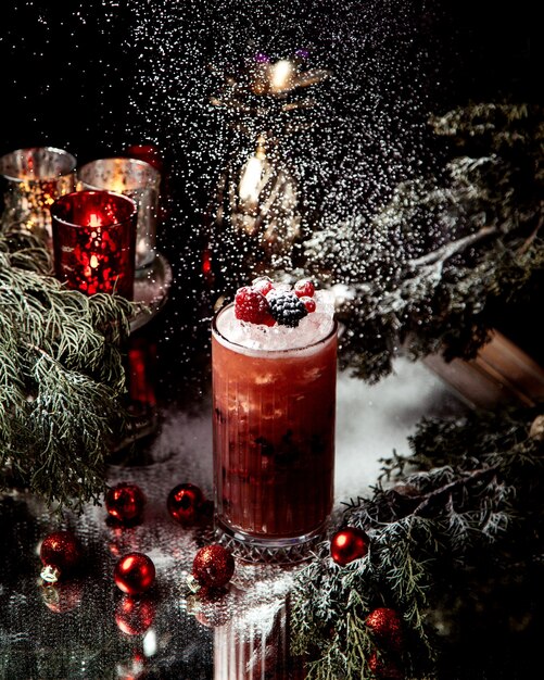 Berry juice  with ice and berries on top