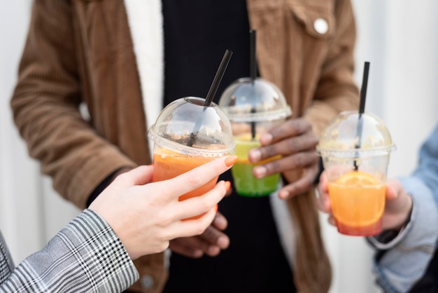 Free photo best friends hanging out while enjoying a delicious drink