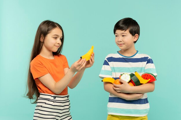 Best friends having fun in a blue summer setting studio