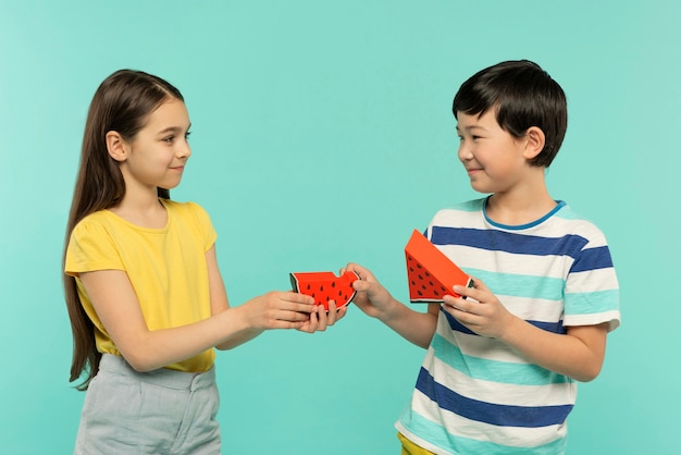 Best friends having fun in a blue summer setting studio