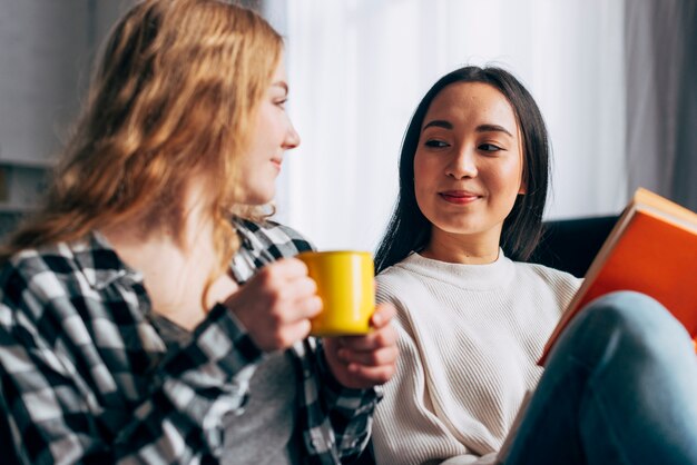 Best friends looking at each other at home