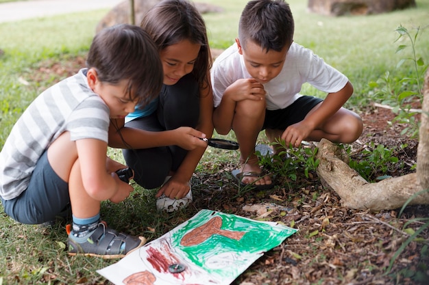 Free photo best friends participating in a treasure hunt outdoors