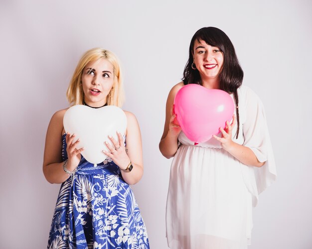 Best friends posing with balloons