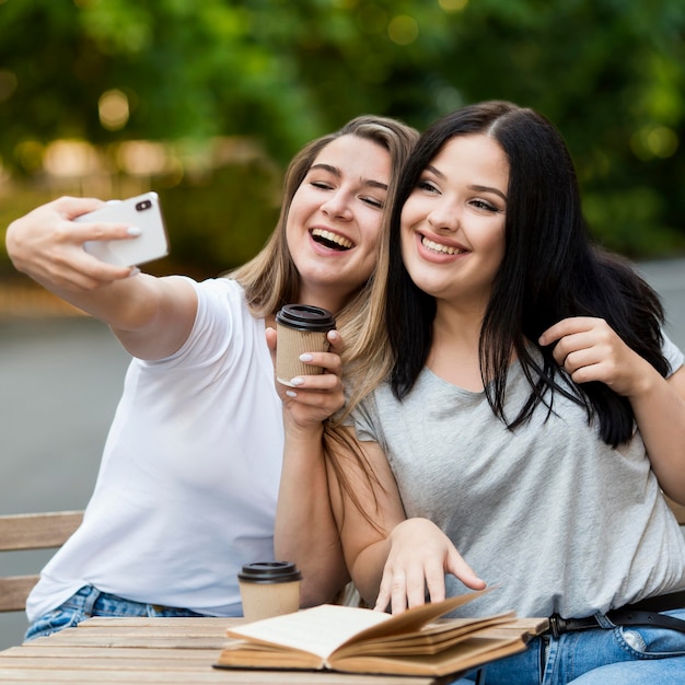 Best friends taking a selfie outdoors