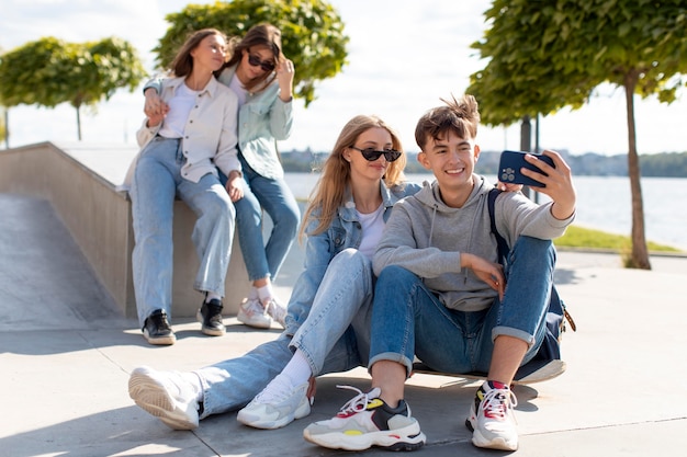 Best friends taking a selfie together outdoors