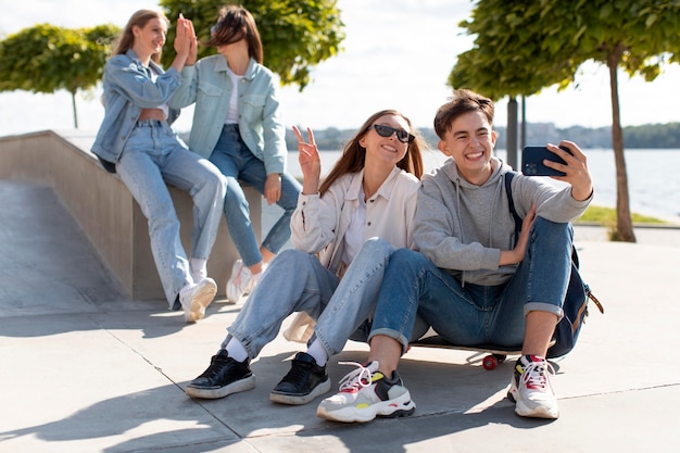 Best friends taking a selfie together outdoors