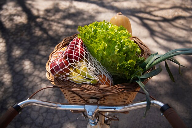 Bicycle basket with fresh groceries high angle