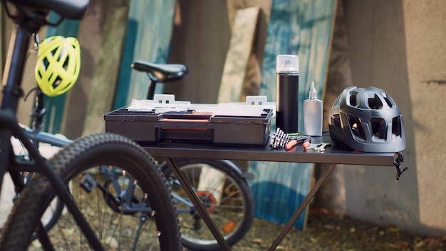 Free Photo bicycle toolbox placed on table in yard