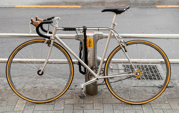 Bicycle with yellow wheels outdoors