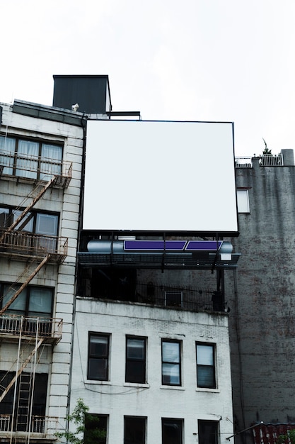 Free photo big billboard template on building in city