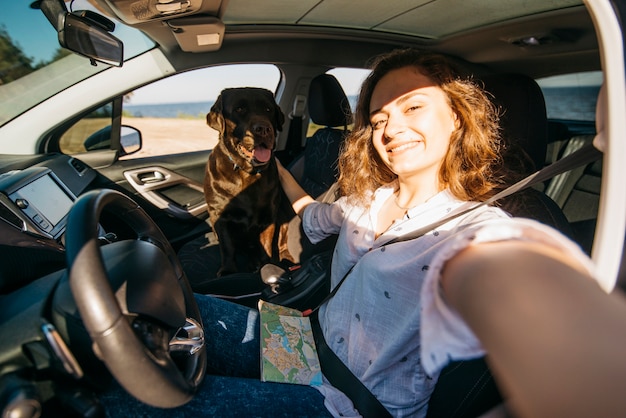 Free photo big black dog in car