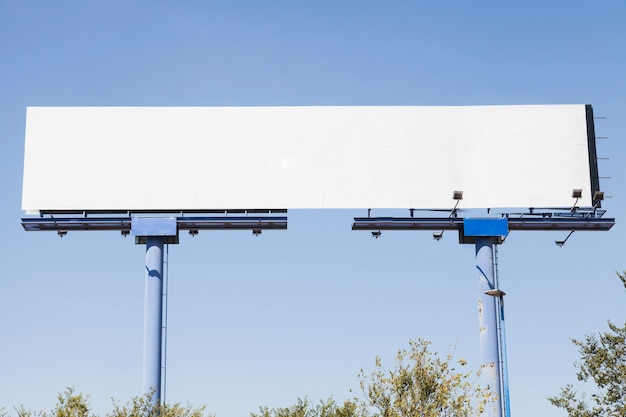 Free Photo big blank advertising hoarding against blue background