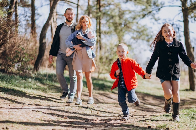 Big family with kids together in the forest