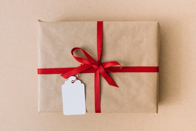 Big gift box with ribbon on table