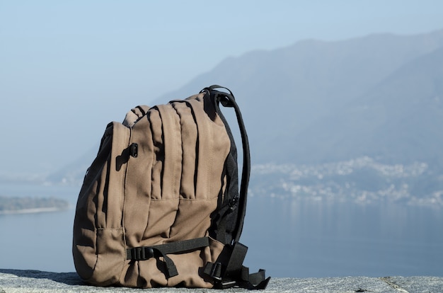 Big hiking backpack with the blurry mountains in the background