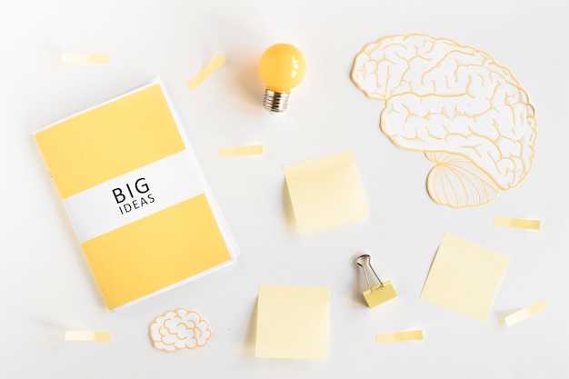 Free Photo big ideas diary, light bulb, brain and stationeries on white background