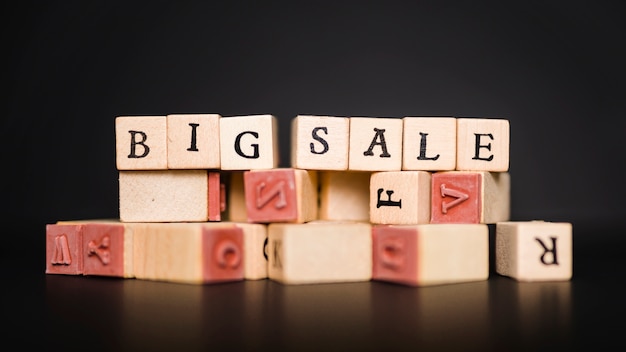 Big sale inscription on wooden blocks on table 