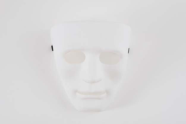 Big white carnival mask on table 