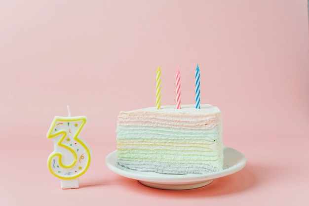 Birthday cake next to candle