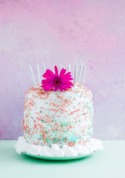 Birthday cake in front of watercolor background