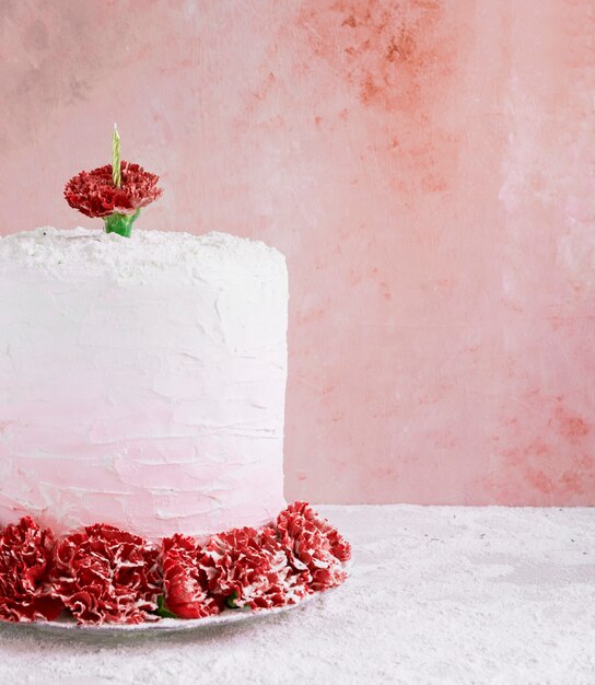 Birthday cake in front of watercolor background