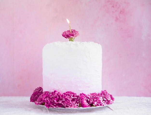 Free photo birthday cake in front of watercolor background