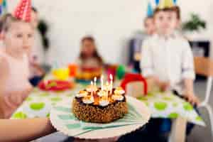 Free photo birthday cake with children on background