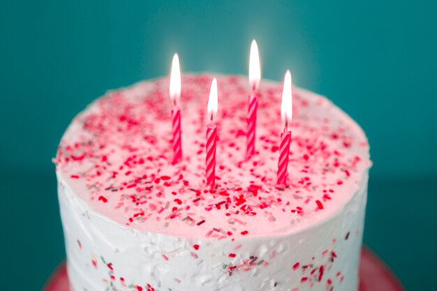 Birthday cake with lit candles