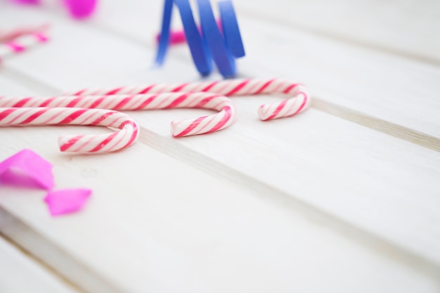 Birthday composition with three spoons on wooden background