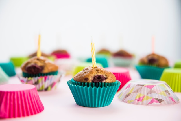 Birthday cupcake in the paper holders with candles