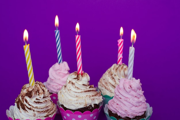 Birthday cupcakes with lit candles