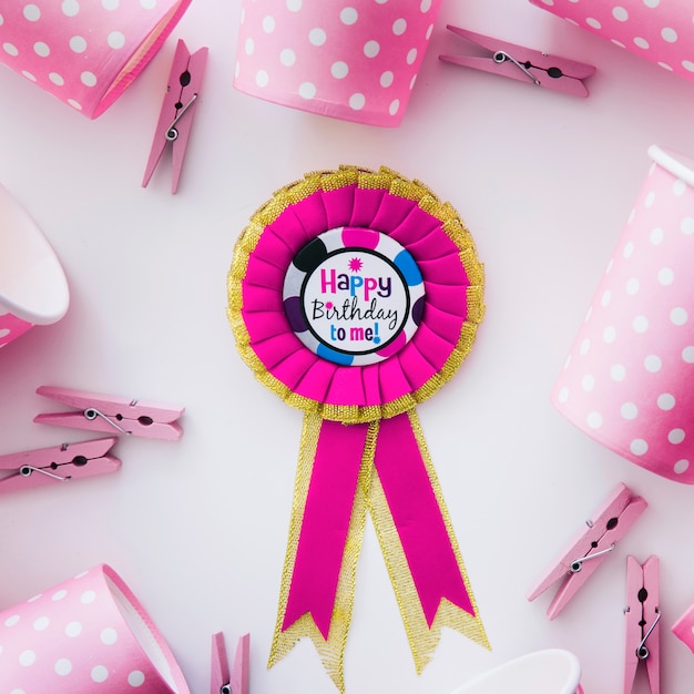 Free Photo birthday medal and pink party stuff