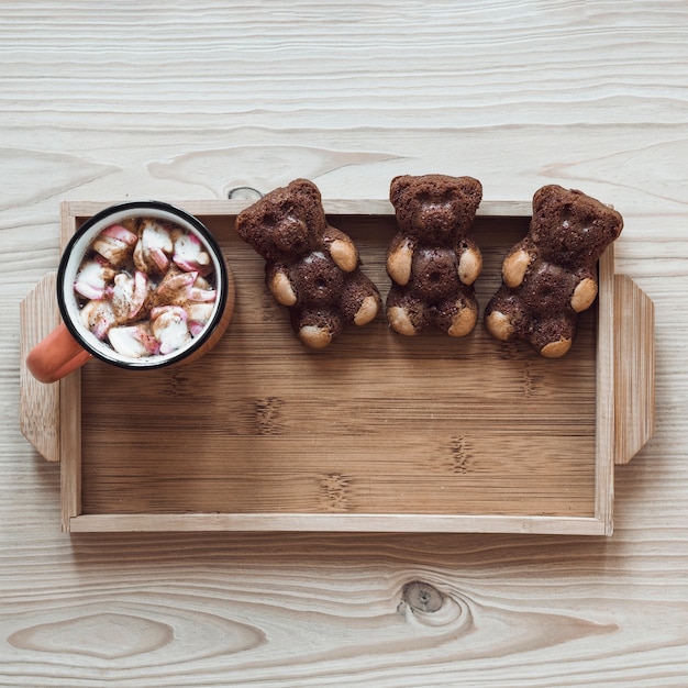 Free photo biscuit bears and hot chocolate on tray