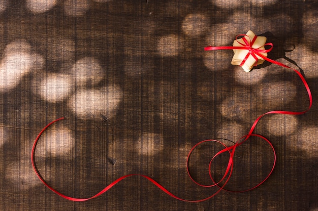 Biscuits with ribbon on brown board 