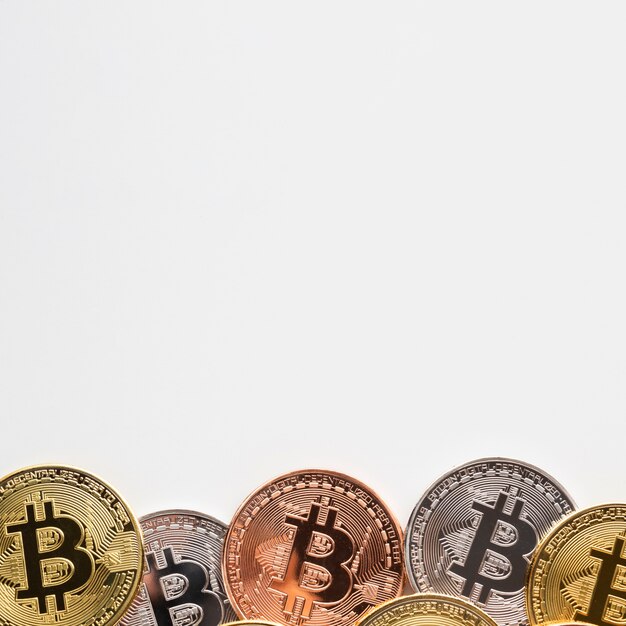 Bitcoin with various colors on plain background