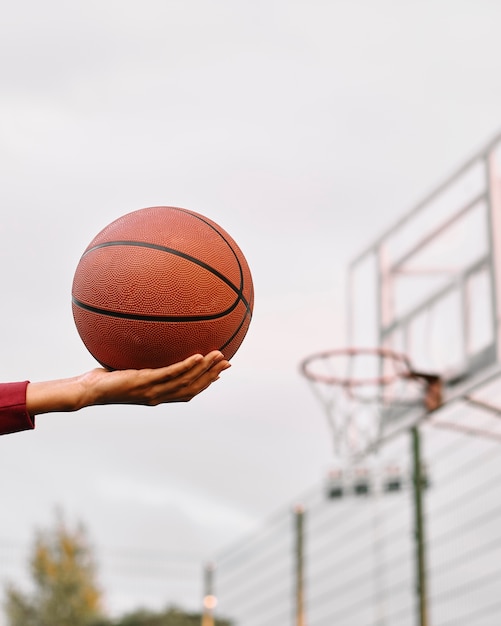 Black american woman playing basketball close-up