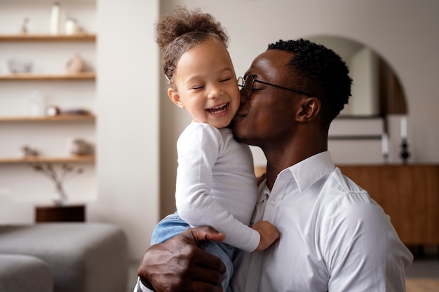 Black baby spending time with her dad