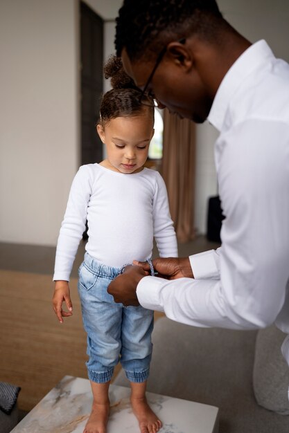 Black baby spending time with her dad