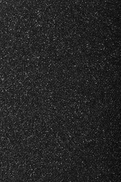 Free Photo black background with defocused glitter