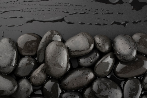 Black background with rocks and water