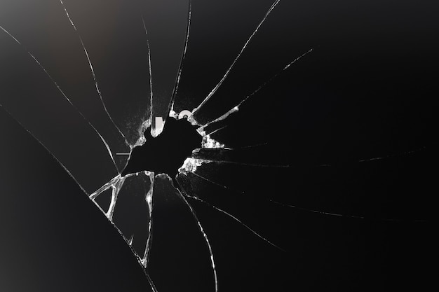 Free Photo black background with shattered glass texture