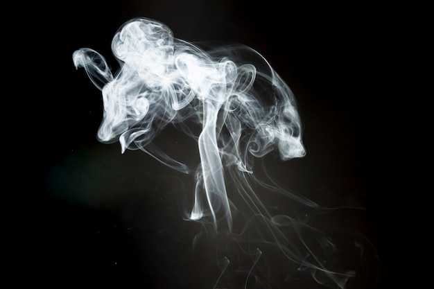 Black background with smoke silhouette