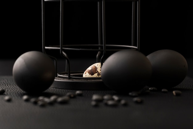 Free Photo black balls on a dark table